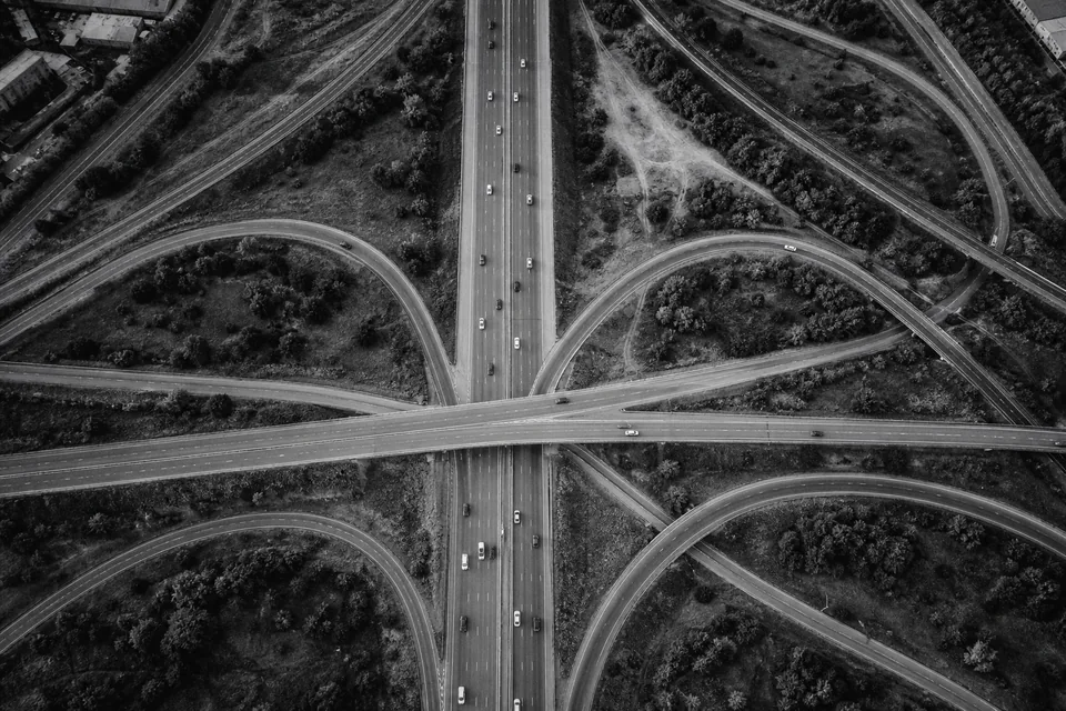 Aerial view of a highway interchange with roads splitting