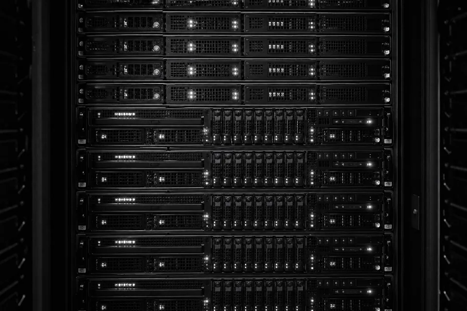 Front panels of servers in a rack with small indicator lights